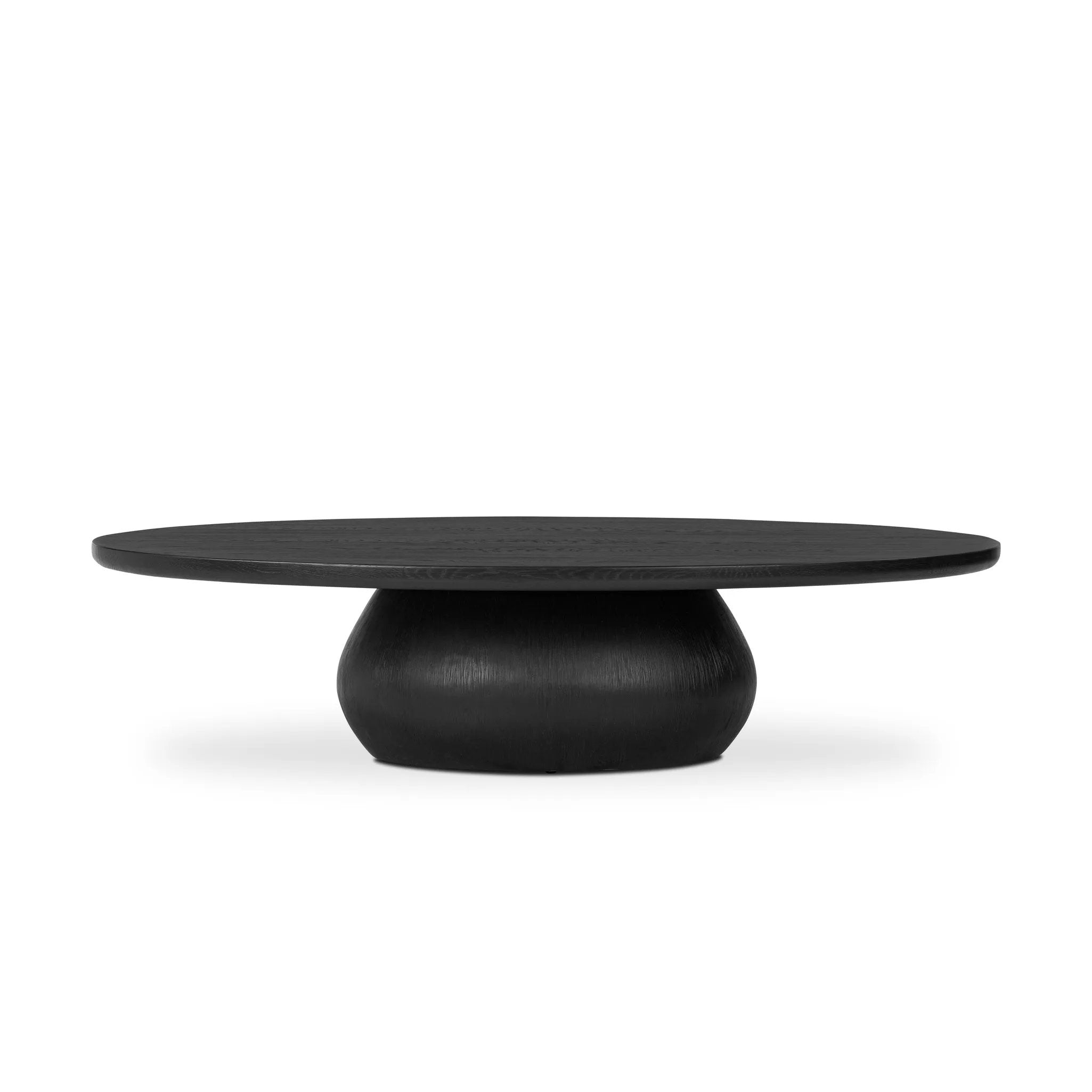 Anchor your space in shape with a beautifully contoured coffee table of worn black resin designed to mimic oak. Rounded oval top features reverse bullnose edging for a design-forward touch Amethyst Home provides interior design, new home construction design consulting, vintage area rugs, and lighting in the Washington metro area.