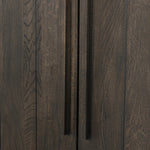 Featuring Elgin Brushed Dark Brown Cabinet by Four Hands at Amethyst Home. A clean, structured piece with plenty of presence. Made from oak and finished in a rich, dark brown, storage-driven cabinetry features plank-style doors, with linear hardware elongating the whole look.Overall Dimensions: 43.00"w x 20.00"d x 78.00"hWeight : 293.21 lbsMaterials: Oak Veneer. Amethyst Home provides interior design, new home construction design consulting, vintage area rugs, and lighting in the Omaha metro area.