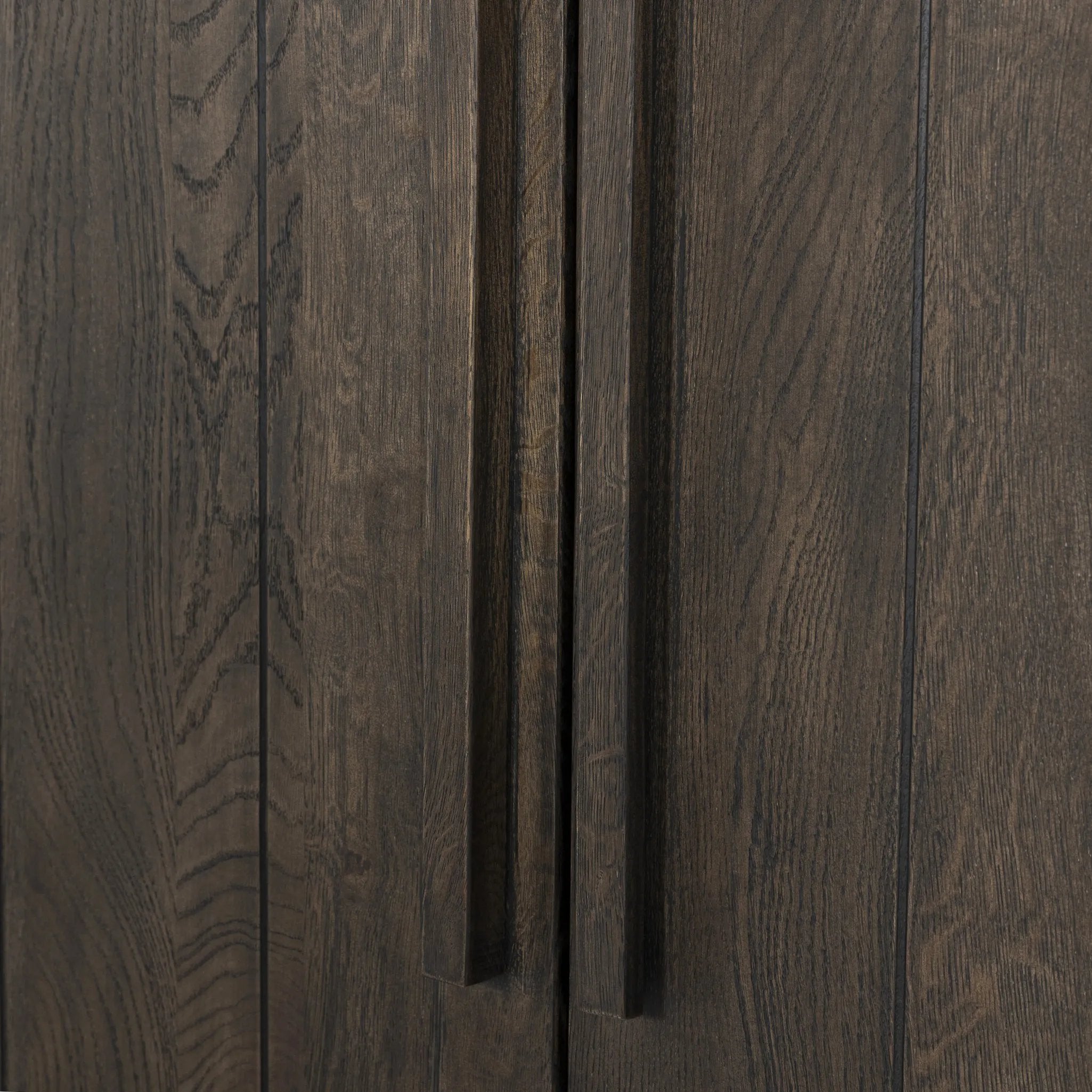Featuring Elgin Brushed Dark Brown Cabinet by Four Hands at Amethyst Home. A clean, structured piece with plenty of presence. Made from oak and finished in a rich, dark brown, storage-driven cabinetry features plank-style doors, with linear hardware elongating the whole look.Overall Dimensions: 43.00"w x 20.00"d x 78.00"hWeight : 293.21 lbsMaterials: Oak Veneer. Amethyst Home provides interior design, new home construction design consulting, vintage area rugs, and lighting in the Omaha metro area.