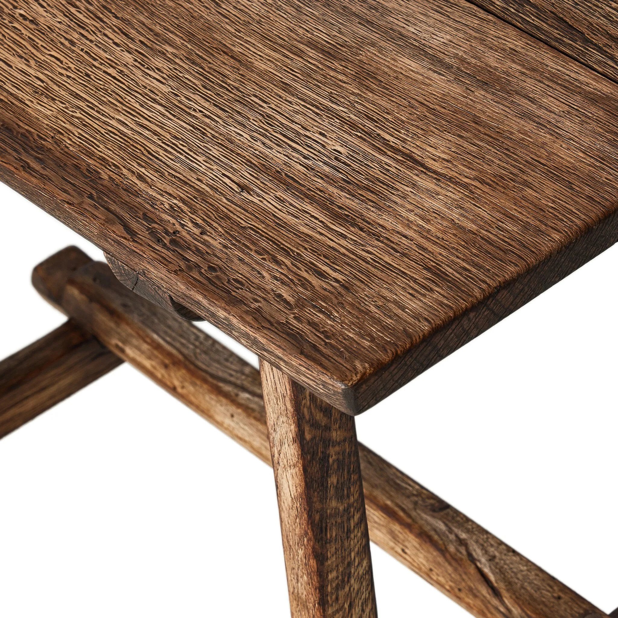 Accent your living space with a Wabi Sabi-inspired end table. Crafted from burnt bleached oak with a trellis base and wide plank top, this artisanal piece embraces the natural cracks and graining reflective of organic materials to bring a beautiful, character-rich look to your space Amethyst Home provides interior design, new home construction design consulting, vintage area rugs, and lighting in the Kansas City metro area.