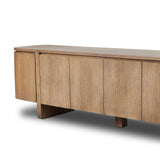 A clean-styled media console made from warm, grain-rich oak. Six doors feature subtle finger grooves for easy open. Gentle curves soften up the look, while a floating design keeps things feeling light and fresh. Inside, generous shelving awaits storage of media and more. Amethyst Home provides interior design, new home construction design consulting, vintage area rugs, and lighting in the Charlotte metro area.