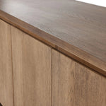 A clean-styled media console made from warm, grain-rich oak. Six doors feature subtle finger grooves for easy open. Gentle curves soften up the look, while a floating design keeps things feeling light and fresh. Inside, generous shelving awaits storage of media and more. Amethyst Home provides interior design, new home construction design consulting, vintage area rugs, and lighting in the Nashville metro area.