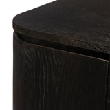 A clean-styled media console made from worn black oak. Six doors feature subtle finger grooves for easy open. Gentle curves soften up the look, while a floating design keeps things feeling light and fresh. Inside, generous shelving awaits storage of media and more. Amethyst Home provides interior design, new home construction design consulting, vintage area rugs, and lighting in the Dallas metro area.