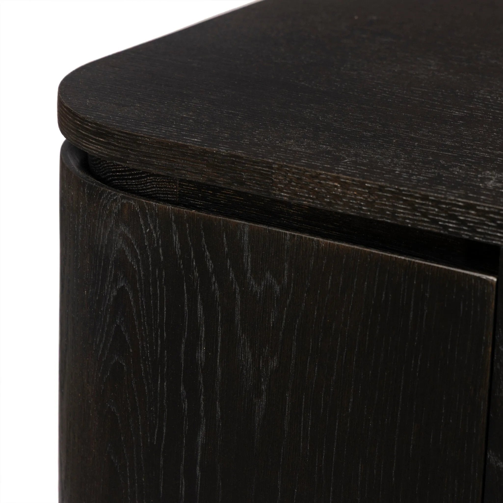 A clean-styled media console made from worn black oak. Six doors feature subtle finger grooves for easy open. Gentle curves soften up the look, while a floating design keeps things feeling light and fresh. Inside, generous shelving awaits storage of media and more. Amethyst Home provides interior design, new home construction design consulting, vintage area rugs, and lighting in the Dallas metro area.