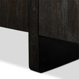 A clean-styled media console made from worn black oak. Six doors feature subtle finger grooves for easy open. Gentle curves soften up the look, while a floating design keeps things feeling light and fresh. Inside, generous shelving awaits storage of media and more. Amethyst Home provides interior design, new home construction design consulting, vintage area rugs, and lighting in the Miami metro area.