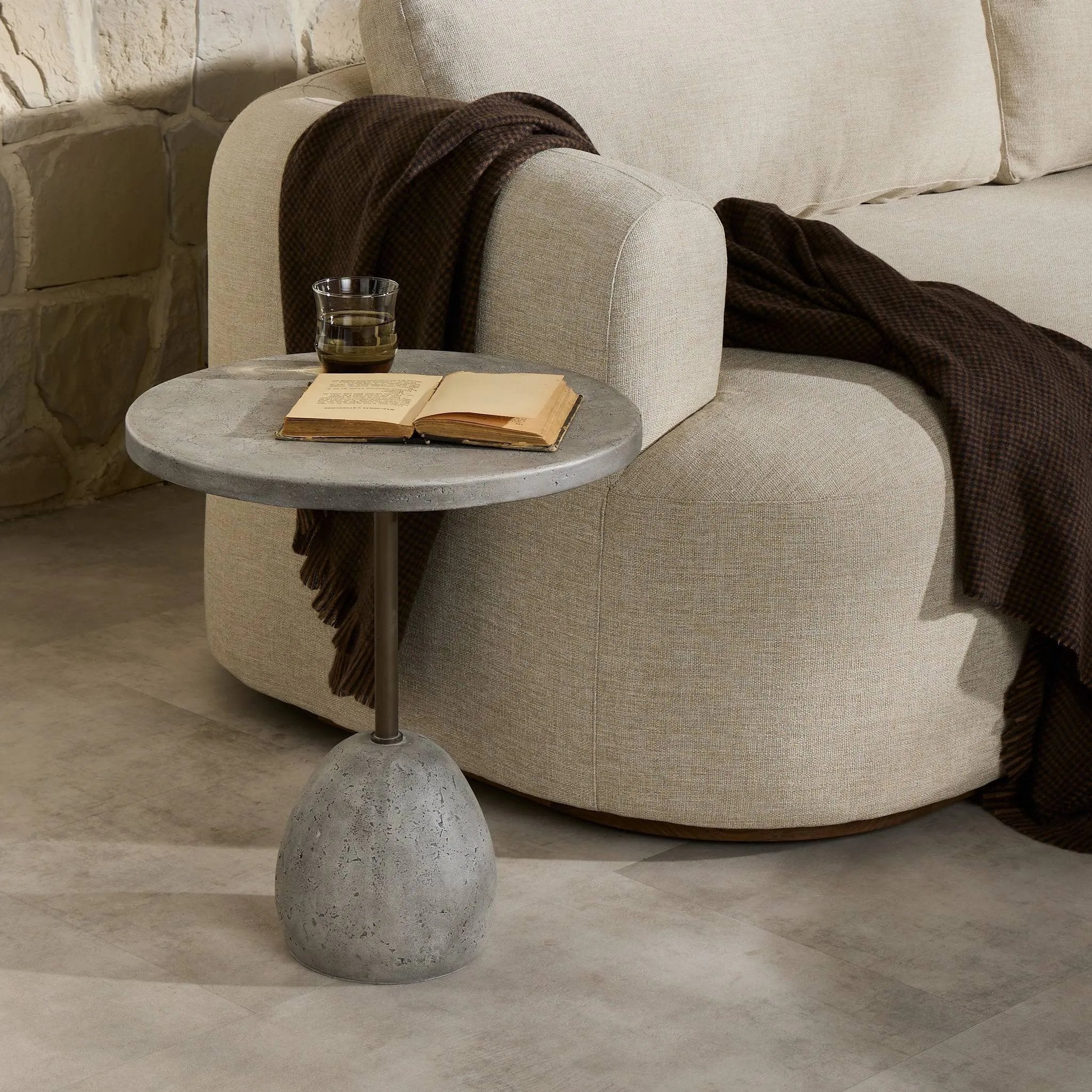 A minimalist end table just made outdoor entertaining easier. Made from solid concrete with an aged smoked finish and sized to be styled seamlessly just about anywhere. Cover or store indoors during inclement weather and when not in use Amethyst Home provides interior design, new home construction design consulting, vintage area rugs, and lighting in the Charlotte metro area.