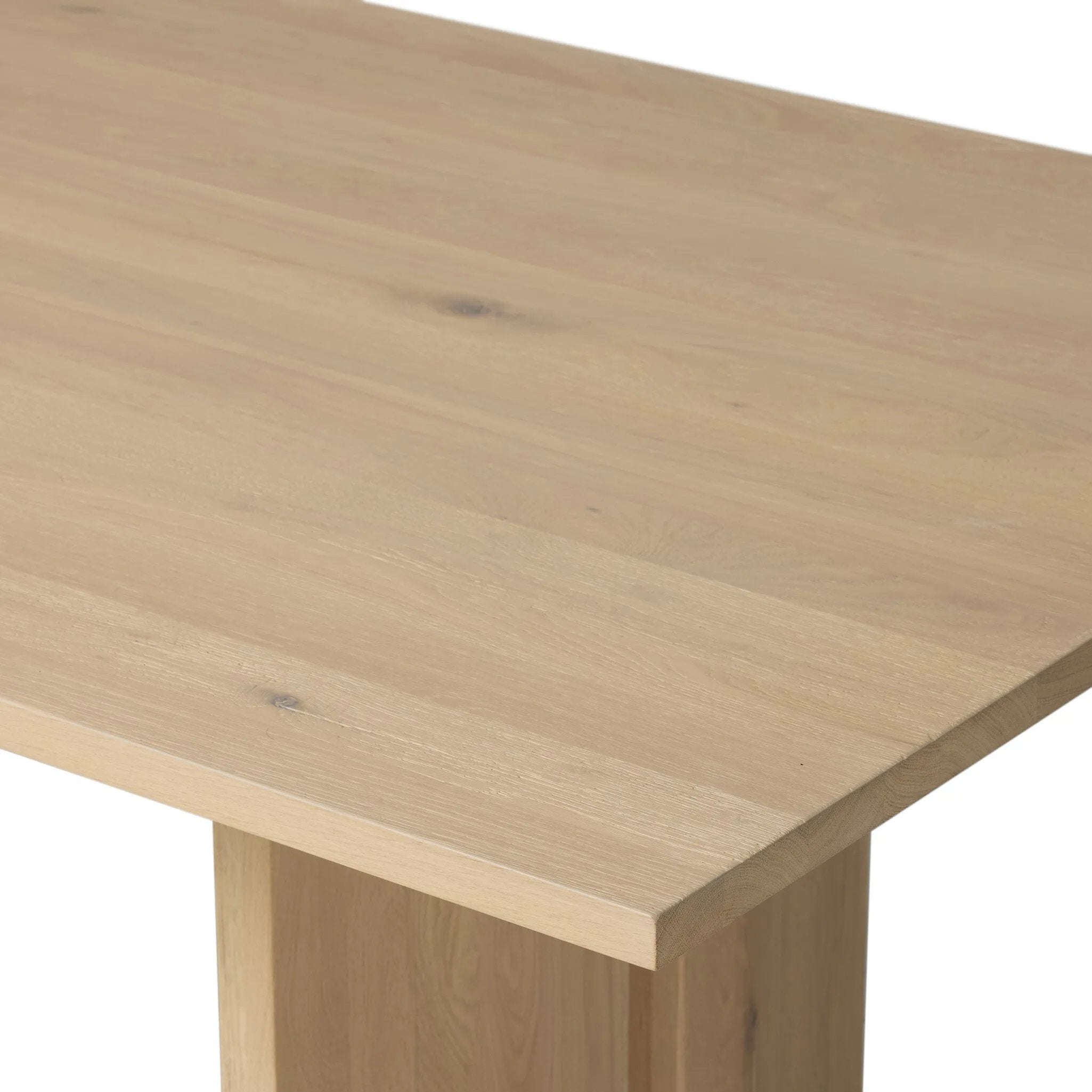 Thoughtful design details takes this long, linear dining table to the next level. Tapered shaping creates a clean, angular profile on the base, with splice leg detailing bringing a design-forward look to the whole piece. Fully crafted from bleached oak sourced from Romania. Amethyst Home provides interior design, new home construction design consulting, vintage area rugs, and lighting in the Calabasas metro area.