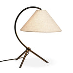 Featuring Emile Matte Black Table Lamp by Four Hands at Amethyst Home. A dramatically curved silhouette and tripod base of matte black metal pair with a flax linen shade for a shapely, minimalist feel.Overall Dimensions: 16.50"w x 14.00"d x 19.00"hWeight : 3.22 lbsMaterials : Iron, Thermoplastic, 75% Flax/Linen, 25% Cotton. Amethyst Home provides interior design, new home construction design consulting, vintage area rugs, and lighting in the Boston metro area.