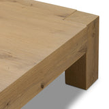 Built from thick-cut oak and veneers with an aged smoked finish, this farmhouse-inspired coffee table features chunky squared legs Amethyst Home provides interior design, new home construction design consulting, vintage area rugs, and lighting in the Boston metro area.