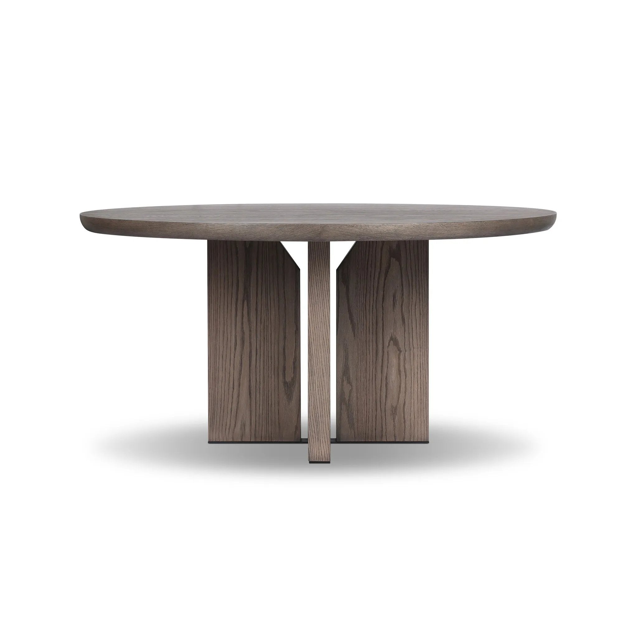 Inspired by minimalist Nordic design, a grey-finished oak dining table has a base of four plinth legs for a simple but impactful detail Amethyst Home provides interior design, new home construction design consulting, vintage area rugs, and lighting in the Omaha metro area.