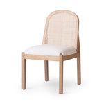 Featuring Esmee Antwerp Natural Dining Chair by Four Hands at Amethyst Home. Natural nettlewood shapes the arched, angled back of this simply shaped, armless dining chair. Natural crosshatch cane adds a light texture to complement the creamy, neutral upholstered seat. Performance fabrics are specially created to withstand spills, stains, high traffic and wear, . Amethyst Home provides interior design, new home construction design consulting, vintage area rugs, and lighting in the Omaha metro area.