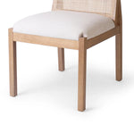 Featuring Esmee Antwerp Natural Dining Chair by Four Hands at Amethyst Home. Natural nettlewood shapes the arched, angled back of this simply shaped, armless dining chair. Natural crosshatch cane adds a light texture to complement the creamy, neutral upholstered seat. Performance fabrics are specially created to withstand spills, stains, high traffic and wea. Amethyst Home provides interior design, new home construction design consulting, vintage area rugs, and lighting in the Portland metro area.