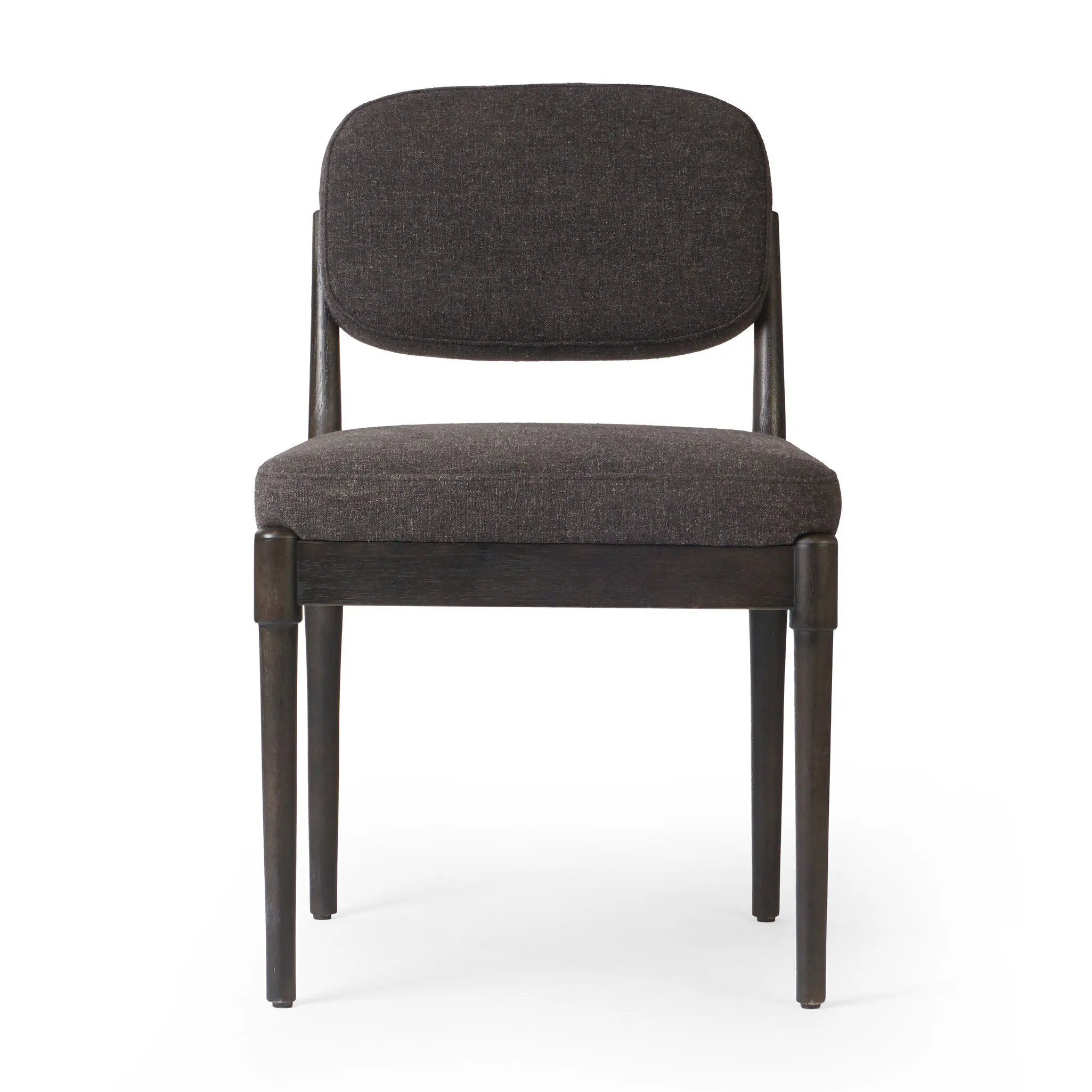 Modern materials place an updated twist on the traditional armless dining chair. Linen/cotton blend cushioning upholstered in high-performance fabric, perfect for everyday dining. Simply framed by burnt oak. Amethyst Home provides interior design, new home construction design consulting, vintage area rugs, and lighting in the Tampa metro area.
