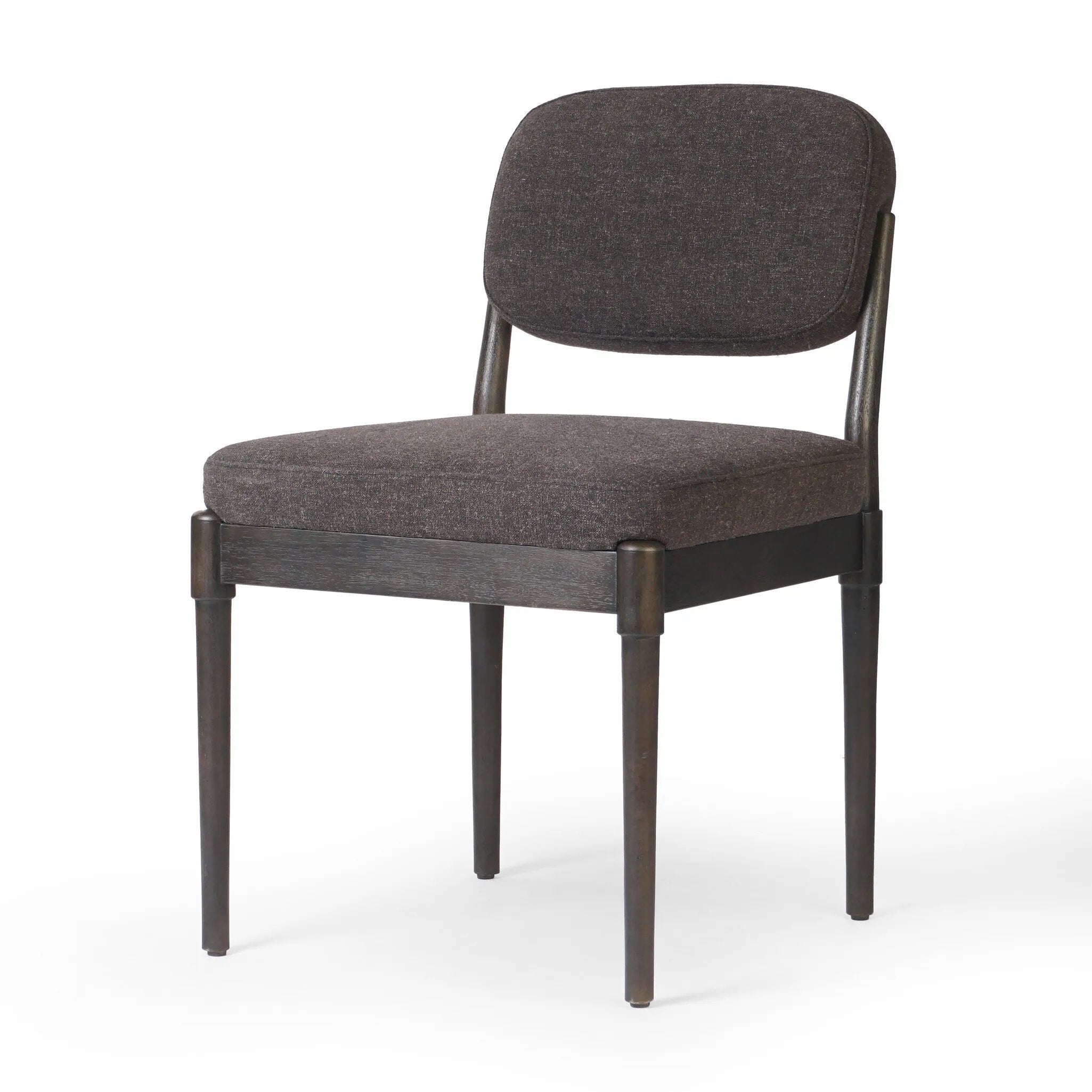 Modern materials place an updated twist on the traditional armless dining chair. Linen/cotton blend cushioning upholstered in high-performance fabric, perfect for everyday dining. Simply framed by burnt oak. Amethyst Home provides interior design, new home construction design consulting, vintage area rugs, and lighting in the Winter Garden metro area.