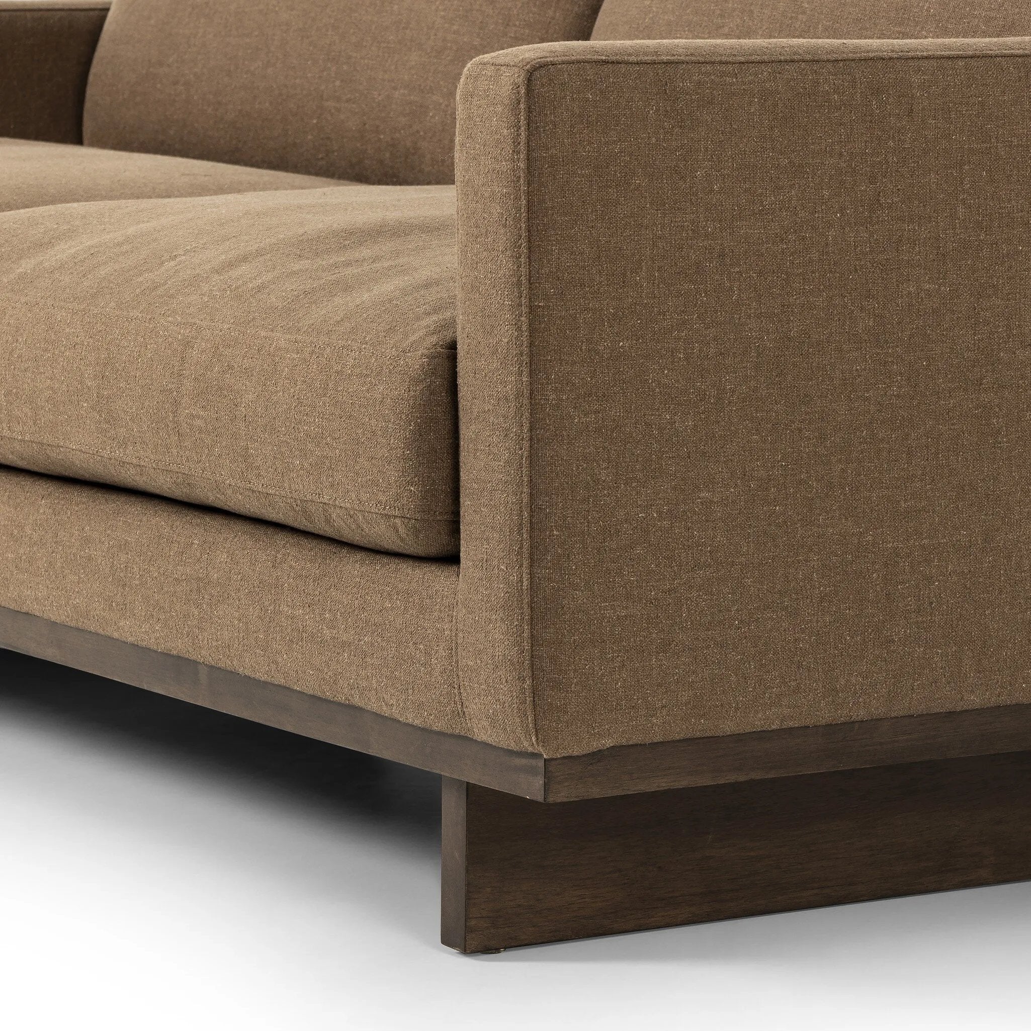 Classic goes contemporary. A brown-finished parawood base supports low, deep seating of high-performance fabric, with track arms for a clean touch.As fans of clean design at Amethyst, we love the warm modern inspired Everly Sofa - Antwerp Cafe. This item pairs well with other brands such as Four Hands and is perfect for minimalist homes Amethyst Home provides interior design, new home construction design consulting, vintage area rugs, and lighting in the Scottsdale metro area.