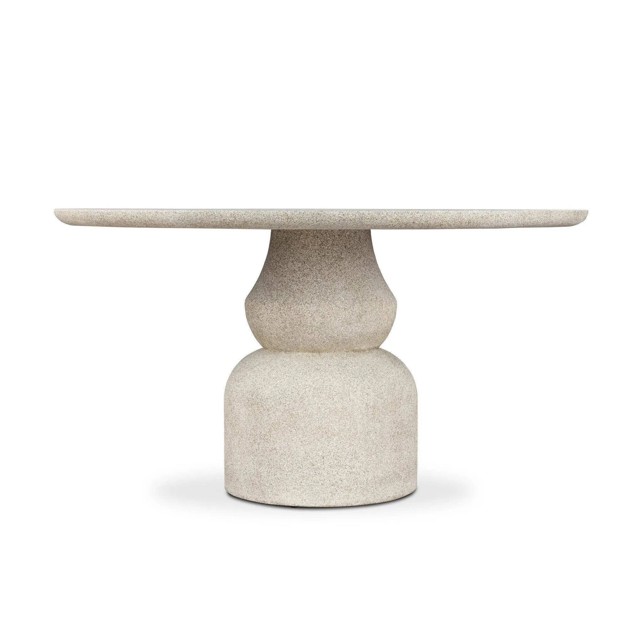 This outdoor dining table brings a fresh take to the classic pedestal silhouette. Shaped in an aged concrete that has lots of character and depth for an authentically weathered look. Cover or store inside during inclement weather and when not in use. Amethyst Home provides interior design, new home construction design consulting, vintage area rugs, and lighting in the Kansas City metro area.