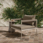 It's all in the mix with this outdoor chair, featuring a rich upholstery with a brushed texture, cord-wrapped arms and a woven back. The low-lying frame makes this the perfect seat for lounging. Cover or store inside during inclement weather and when not in use. Amethyst Home provides interior design, new home construction design consulting, vintage area rugs, and lighting in the Alpharetta metro area.