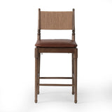 Classic meets current. Simplified turn shaping meets subtly curved legs to elevate a clean, traditional frame of walnut-finished solid ash. A brown top-grain leather cushion complements a back rest of textural paper cord. A design collaboration by Amber Lewis and Four Hands. Amethyst Home provides interior design, new home construction design consulting, vintage area rugs, and lighting in the Tampa metro area.