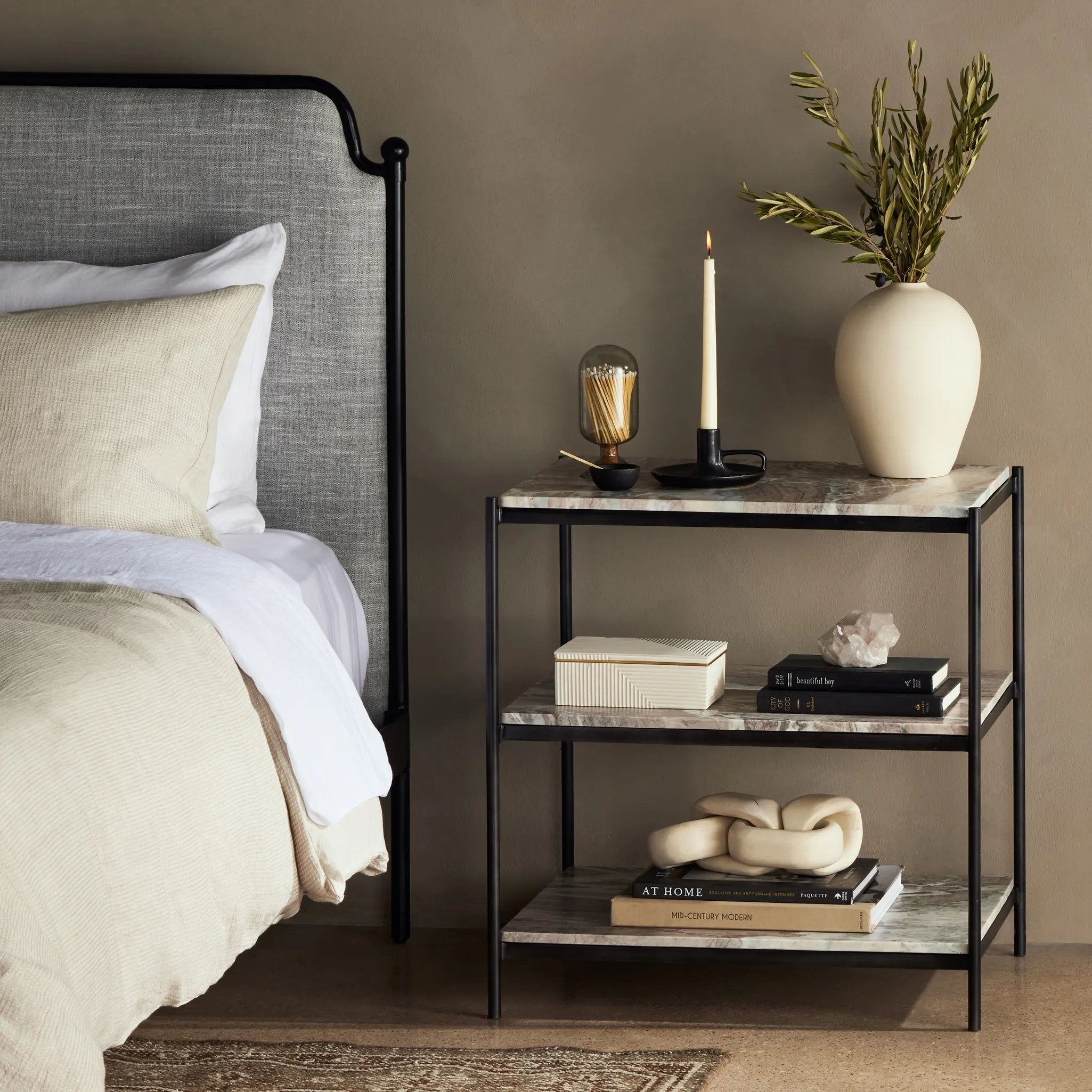 Add a pop of sophistication to any space. Naturally variegated marble hues offer three refreshing tiers of smooth shelving for plenty of space, while hammered grey-finished iron framing places a feminine, high-contrast spin on bedside storage Amethyst Home provides interior design, new home construction design consulting, vintage area rugs, and lighting in the Charlotte metro area.