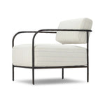 A slim take on a timeless silhouette. Hammered iron frames a squared seat and bolster back upholstered in striped, neutral fabric. Cover or store inside during inclement weather and when not in use.As enthusiasts of organic modern style at Amethyst, we love the nature inspired Fenn Outdoor Chair - Amalfi Natural. Amethyst Home provides interior design, new home construction design consulting, vintage area rugs, and lighting in the Austin metro area.