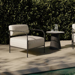 A slim take on a timeless silhouette. Hammered iron frames a squared seat and bolster back upholstered in striped, neutral fabric. Cover or store inside during inclement weather and when not in use.As enthusiasts of organic modern style at Amethyst, we love the nature inspired Fenn Outdoor Chair - Amalfi Natural. Amethyst Home provides interior design, new home construction design consulting, vintage area rugs, and lighting in the Boston metro area.