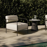 A slim take on a timeless silhouette. Hammered iron frames a squared seat and bolster back upholstered in striped, neutral fabric. Cover or store inside during inclement weather and when not in use.As enthusiasts of organic modern style at Amethyst, we love the nature inspired Fenn Outdoor Chair - Amalfi Natural. Amethyst Home provides interior design, new home construction design consulting, vintage area rugs, and lighting in the Boston metro area.
