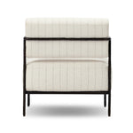 A slim take on a timeless silhouette. Hammered iron frames a squared seat and bolster back upholstered in striped, neutral fabric. Cover or store inside during inclement weather and when not in use.As enthusiasts of organic modern style at Amethyst, we love the nature inspired Fenn Outdoor Chair - Amalfi Natural. Amethyst Home provides interior design, new home construction design consulting, vintage area rugs, and lighting in the Laguna Beach metro area.