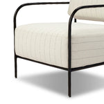 A slim take on a timeless silhouette. Hammered iron frames a squared seat and bolster back upholstered in striped, neutral fabric. Cover or store inside during inclement weather and when not in use.As enthusiasts of organic modern style at Amethyst, we love the nature inspired Fenn Outdoor Chair - Amalfi Natural. Amethyst Home provides interior design, new home construction design consulting, vintage area rugs, and lighting in the Park City metro area.