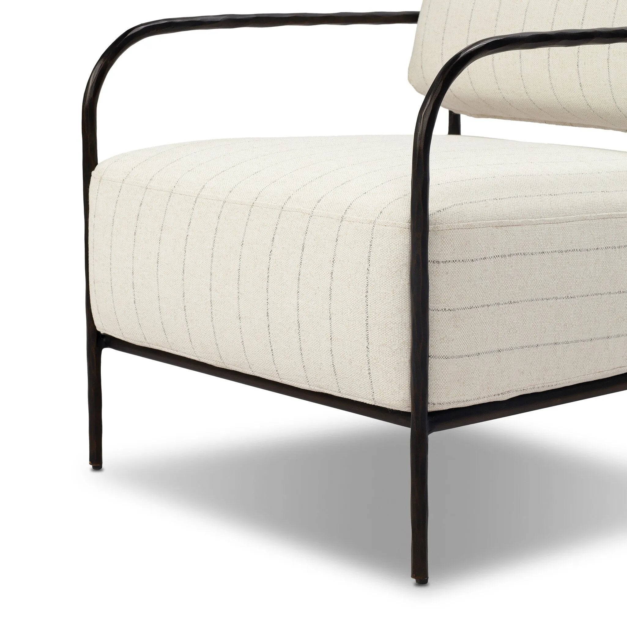 A slim take on a timeless silhouette. Hammered iron frames a squared seat and bolster back upholstered in striped, neutral fabric. Cover or store inside during inclement weather and when not in use.As enthusiasts of organic modern style at Amethyst, we love the nature inspired Fenn Outdoor Chair - Amalfi Natural. Amethyst Home provides interior design, new home construction design consulting, vintage area rugs, and lighting in the Park City metro area.