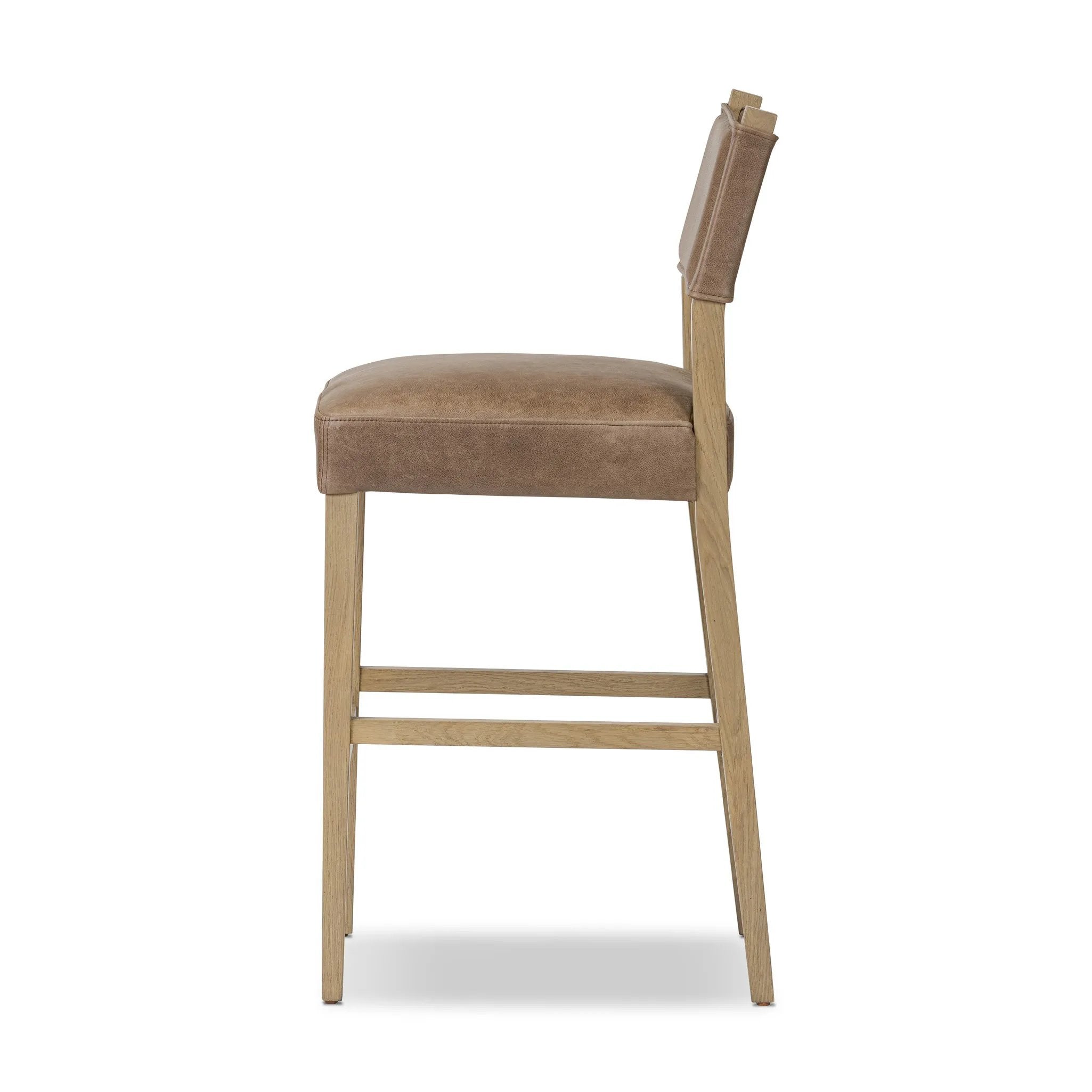 Featuring Ferris Palermo Cigar Bar + Counter Stool by Four Hands at Amethyst Home. Perfectly sized for the counter, black-finished parawood frames squared seating of high-performance fabric, with black top-grain leather backing. Performance fabrics are specially created to withstand spills, stains, high traffic and wear, ensuring long-term comfort and unmatched. Amethyst Home provides interior design, new home construction design consulting, vintage area rugs, and lighting in the Miami metro area.