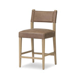 Featuring Ferris Palermo Cigar Bar + Counter Stool by Four Hands at Amethyst Home. Perfectly sized for the counter, black-finished parawood frames squared seating of high-performance fabric, with black top-grain leather backing. Performance fabrics are specially created to withstand spills, stains, high traffic and wear, ensuring long-term comfort and unmatched. Amethyst Home provides interior design, new home construction design consulting, vintage area rugs, and lighting in the Tampa metro area.