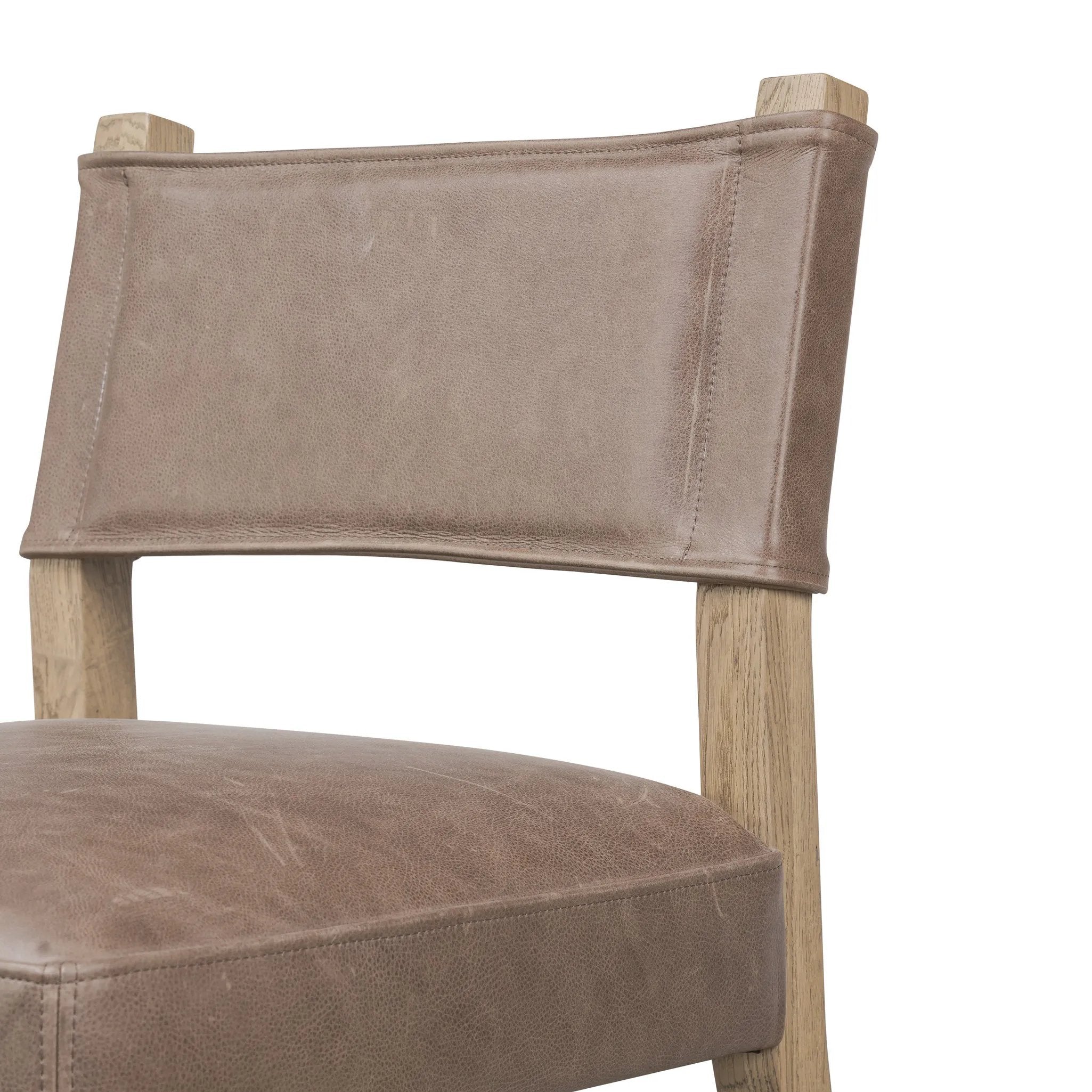 Featuring Ferris Palermo Cigar Dining Chair by Four Hands at Amethyst Home. Mixed materials at their finest. Brown parawood forms a slight, simple frame for squared seating of neutral performance-grade upholstery. Charcoal top-grain leather backing takes this modern-minded dining chair to the next level.Overall Dimensions: 20.00"w x 22.00"d x 32.00"hWeight : 16. Amethyst Home provides interior design, new home construction design consulting, vintage area rugs, and lighting in the Miami metro area.