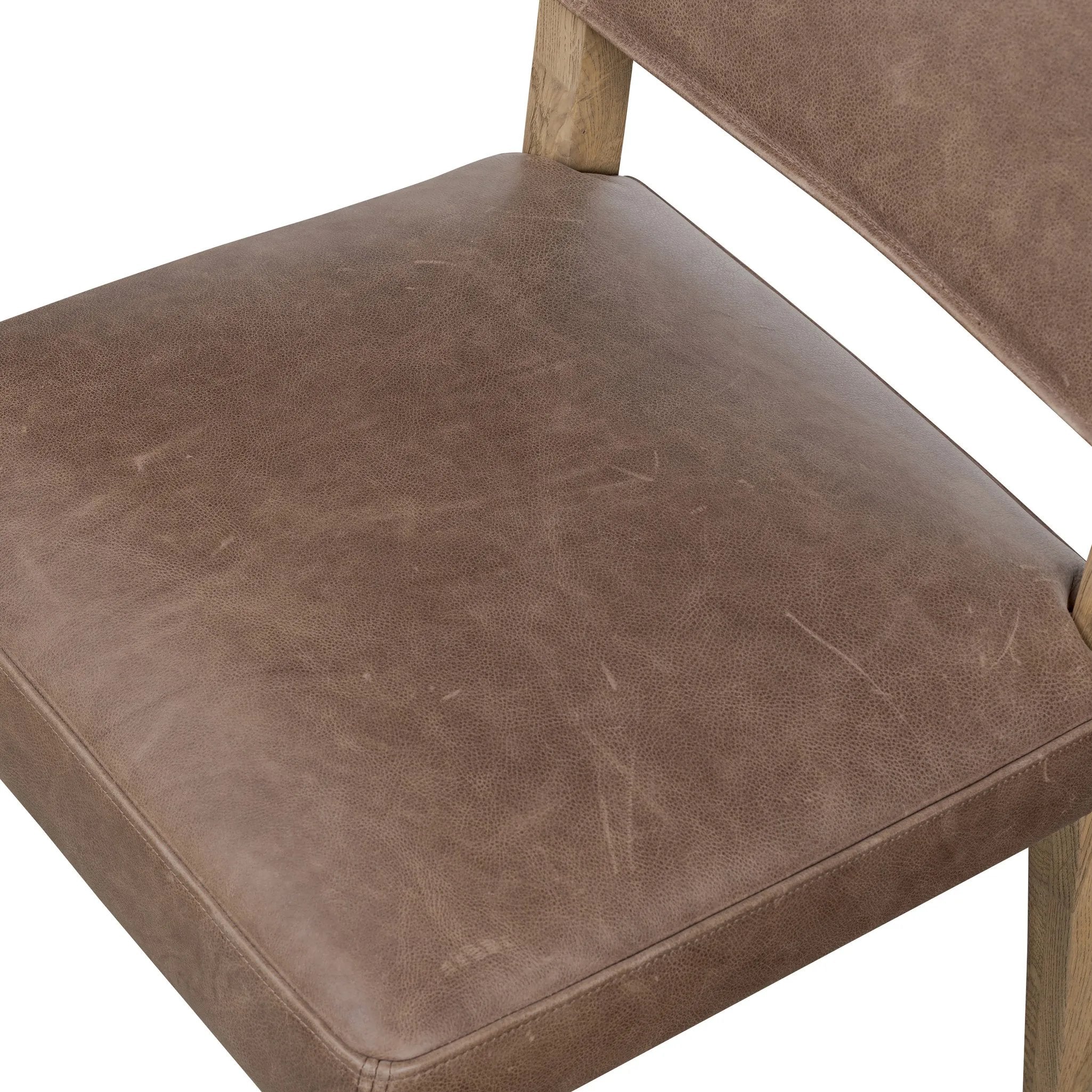 Featuring Ferris Palermo Cigar Dining Chair by Four Hands at Amethyst Home. Mixed materials at their finest. Brown parawood forms a slight, simple frame for squared seating of neutral performance-grade upholstery. Charcoal top-grain leather backing takes this modern-minded dining chair to the next level.Overall Dimensions: 20.00"w x 22.00"d x 32.00"hWeight :. Amethyst Home provides interior design, new home construction design consulting, vintage area rugs, and lighting in the Portland metro area.