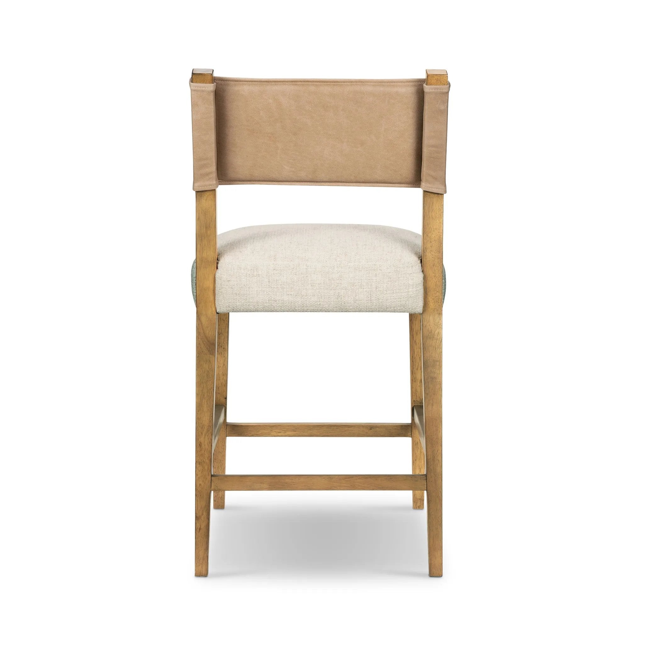 Featuring Ferris Thames Cream Bar + Counter Stool by Four Hands at Amethyst Home. Perfectly sized for the counter, burnished parawood frames squared seating of high-performance fabric, with beige top-grain leather backing. Performance fabrics are specially created to withstand spills, stains, high traffic and wear, ensuring long-term comfort and unmatched dur. Amethyst Home provides interior design, new home construction design consulting, vintage area rugs, and lighting in the Houston metro area.