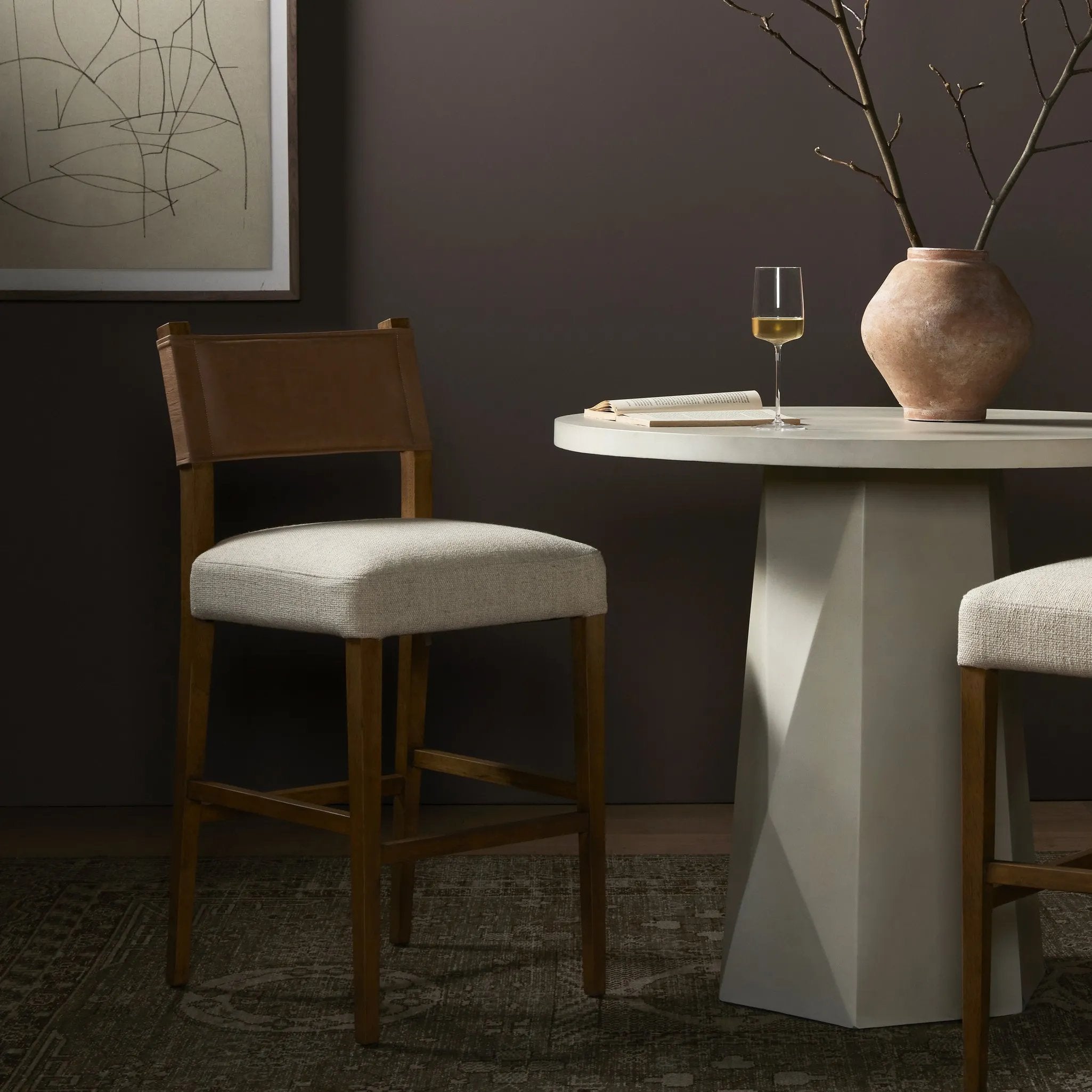 Featuring Ferris Thames Cream Bar + Counter Stool by Four Hands at Amethyst Home. Perfectly sized for the counter, burnished parawood frames squared seating of high-performance fabric, with beige top-grain leather backing. Performance fabrics are specially created to withstand spills, stains, high traffic and wear, ensuring long-term comfort and unmatched durab. Amethyst Home provides interior design, new home construction design consulting, vintage area rugs, and lighting in the Miami metro area.