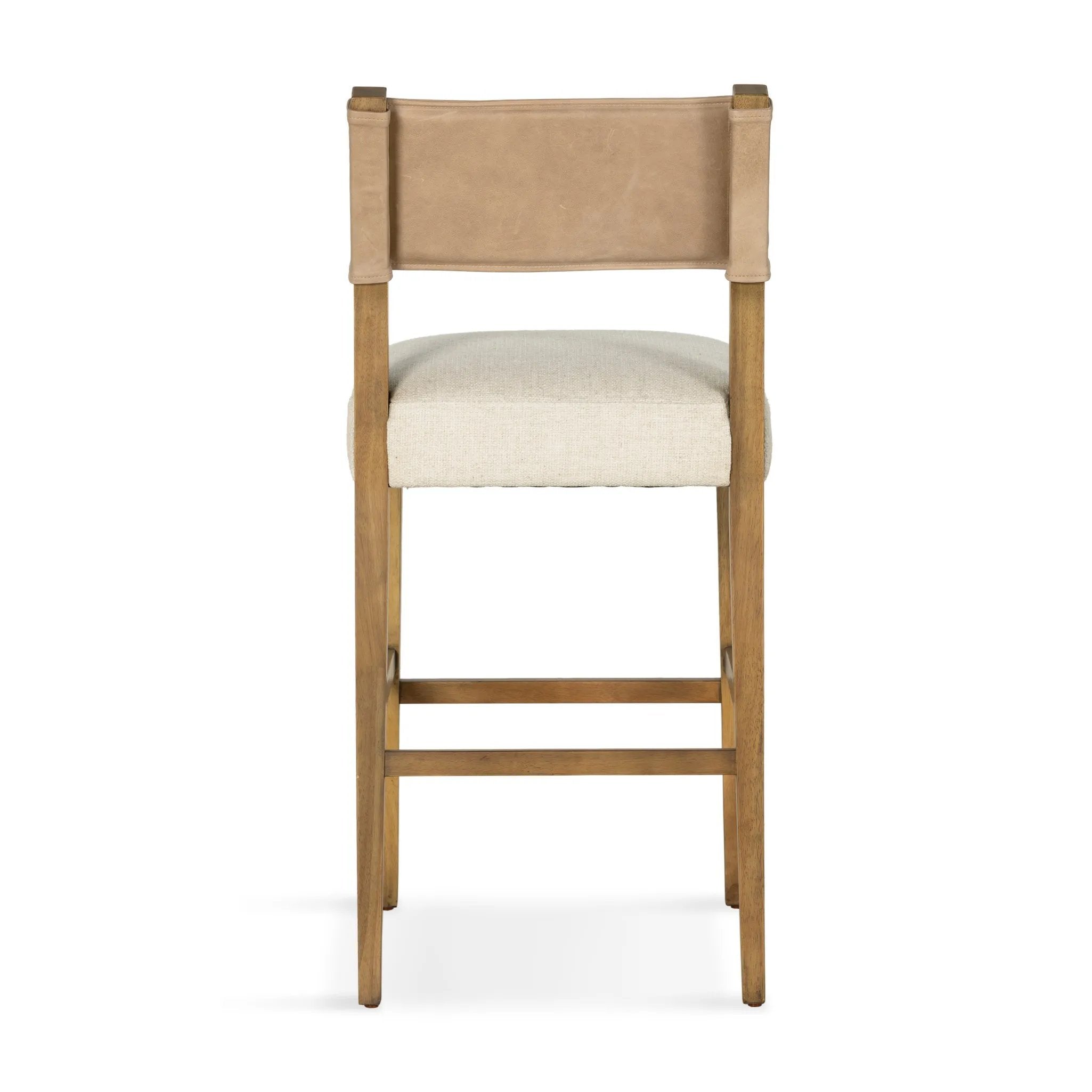Featuring Ferris Thames Cream Bar + Counter Stool by Four Hands at Amethyst Home. Perfectly sized for the counter, burnished parawood frames squared seating of high-performance fabric, with beige top-grain leather backing. Performance fabrics are specially created to withstand spills, stains, high traffic and wear, ensuring long-term comfort and unmatched d. Amethyst Home provides interior design, new home construction design consulting, vintage area rugs, and lighting in the Nashville metro area.