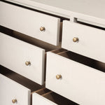Featuring Fiona Ivory Painted Raffia 6 Drawer Dresser by Four Hands at Amethyst Home. Indulge in luxury with the Fiona Ivory Painted Raffia 6 Drawer Dresser. This elegant dresser boasts a sophisticated ivory painted finish and hand-woven raffia drawers. With six spacious drawers, it offers ample storage space while adding a touch of exclusivity to any bedroom.. Amethyst Home provides interior design, new home construction design consulting, vintage area rugs, and lighting in the Dallas metro area.