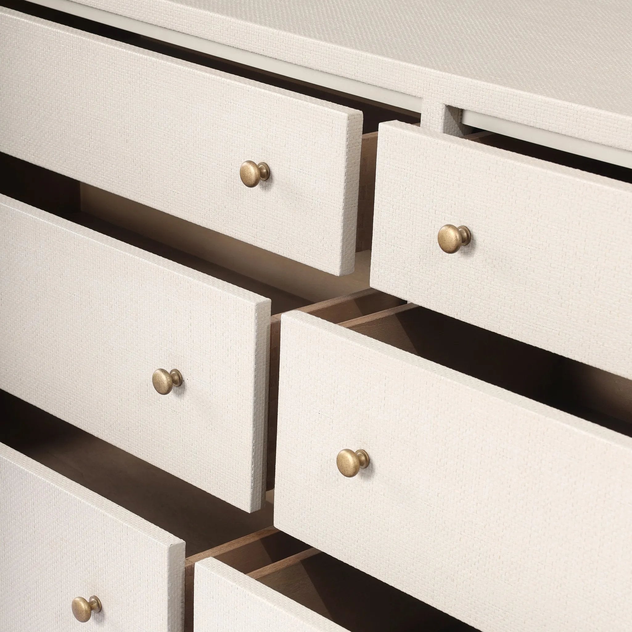 Featuring Fiona Ivory Painted Raffia 6 Drawer Dresser by Four Hands at Amethyst Home. Indulge in luxury with the Fiona Ivory Painted Raffia 6 Drawer Dresser. This elegant dresser boasts a sophisticated ivory painted finish and hand-woven raffia drawers. With six spacious drawers, it offers ample storage space while adding a touch of exclusivity to any bedroom.. Amethyst Home provides interior design, new home construction design consulting, vintage area rugs, and lighting in the Dallas metro area.