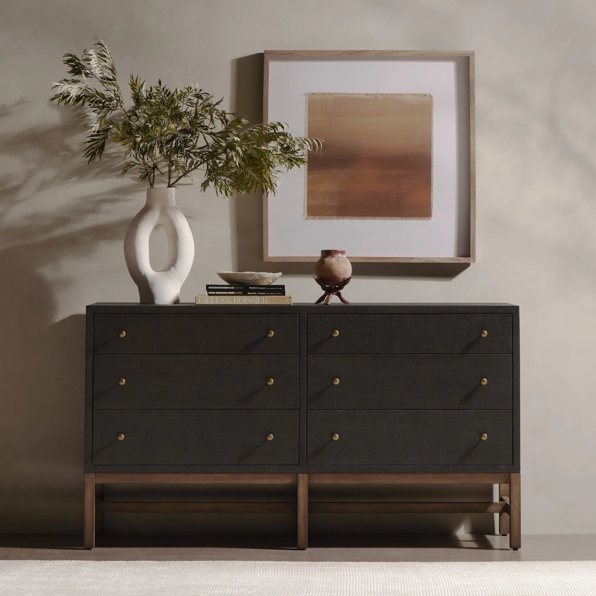 Featuring Fiona Russet Mahogany 6 Drawer Dresser by Four Hands at Amethyst Home. Woven black raffia offers a texture-driven take on bedroom storage. Antique brass-finished iron hardware adorns six spacious drawers, all supported by a solid mahogany base.Overall Dimensions: 62.00"w x 17.00"d x 34.00"hWeight : 181.22 lbsMaterials : Solid Mahogany, Sugar Palm, I. Amethyst Home provides interior design, new home construction design consulting, vintage area rugs, and lighting in the Seattle metro area.