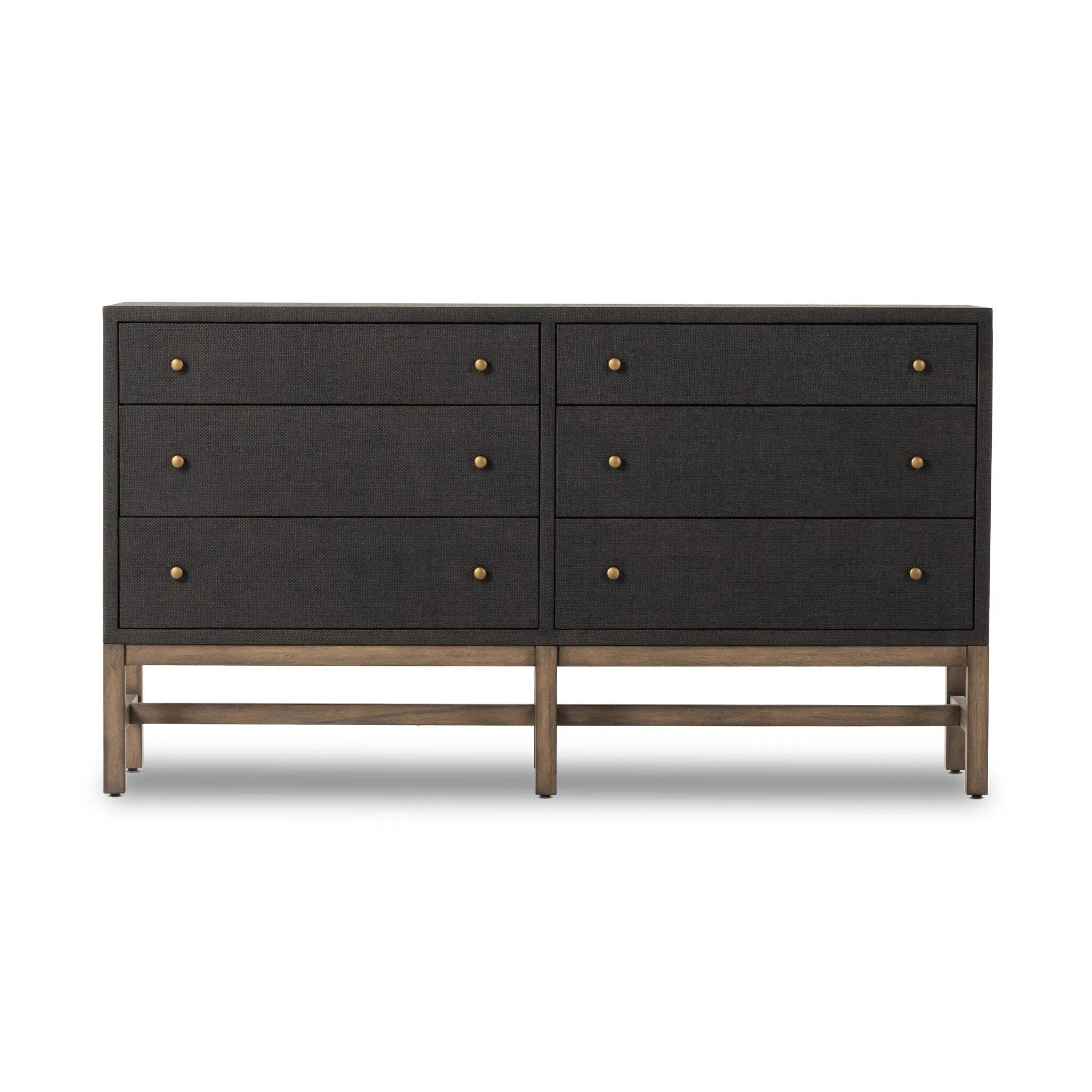 Woven black raffia offers a texture-driven take on bedroom storage. Antique brass-finished iron hardware adorns six spacious drawers, all supported by a solid mahogany base Amethyst Home provides interior design, new home construction design consulting, vintage area rugs, and lighting in the Washington metro area.