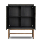 Featuring Fiona Russet Mahogany Bar Cabinet by Four Hands at Amethyst Home. Woven black raffia places a texture-driven twist on cabinetry. Simple hardware finished in an antique brass, all supported by an open, airy base of solid mahogany.Overall Dimensions: 40.00"w x 18.00"d x 52.00"hWeight : 157.63 lbsMaterials: Solid Mahogany, Iron, Sugar Palm. Amethyst Home provides interior design, new home construction design consulting, vintage area rugs, and lighting in the Newport Beach metro area.