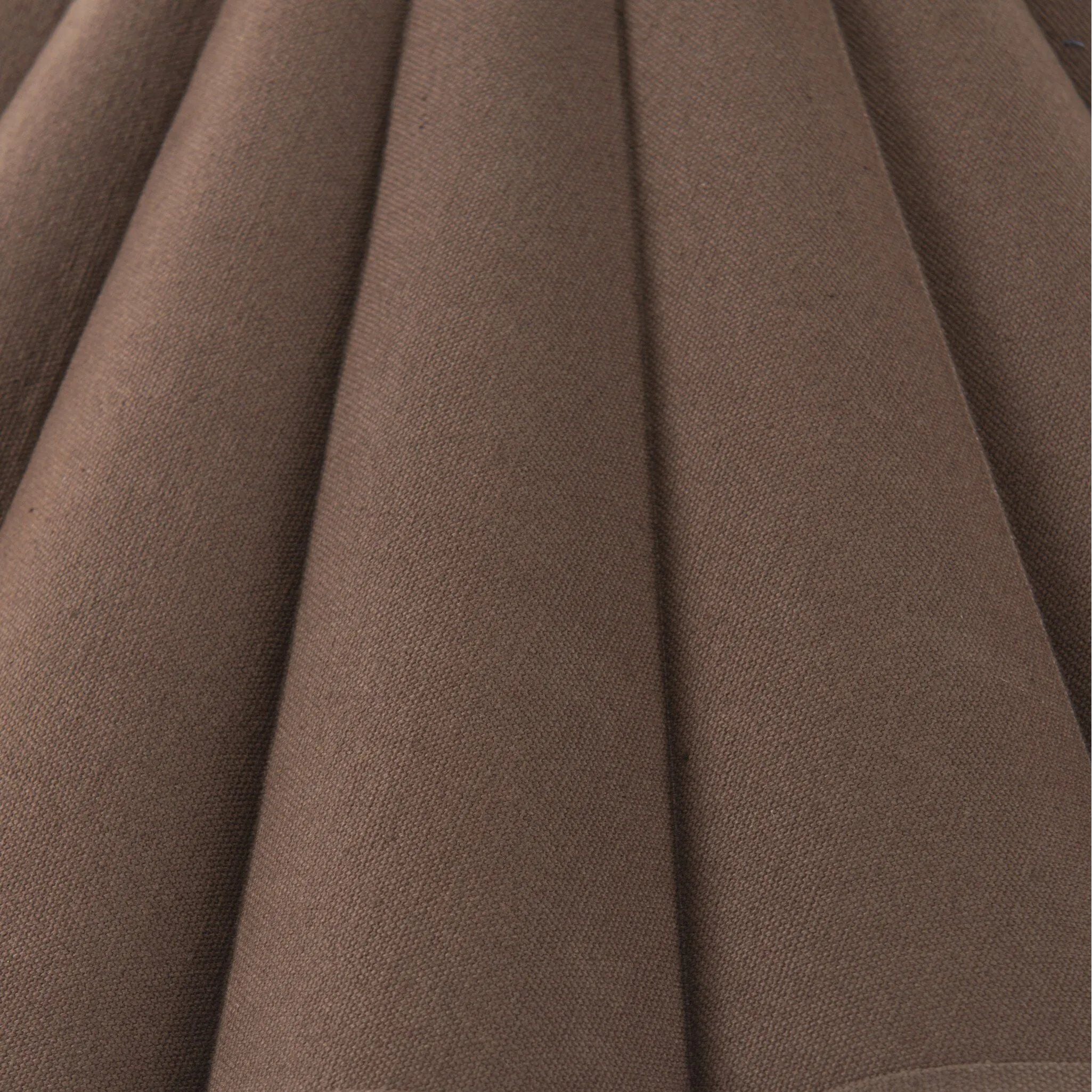 Textures and deep hues unite for this floor lamp's beautiful glow. The scalloped shade features a dark canvas exterior covering an antiqued brass interior, and wrought iron pull chains adjust each lightbulb in Baroque-era form Amethyst Home provides interior design, new home construction design consulting, vintage area rugs, and lighting in the Washington metro area.