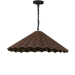 Textures and deep hues unite for this pendant's beautiful glow. The overscale scalloped shade features a dark canvas exterior covering an antiqued brass interior, and a wrought iron chain for maximum drama Amethyst Home provides interior design, new home construction design consulting, vintage area rugs, and lighting in the Newport Beach metro area.