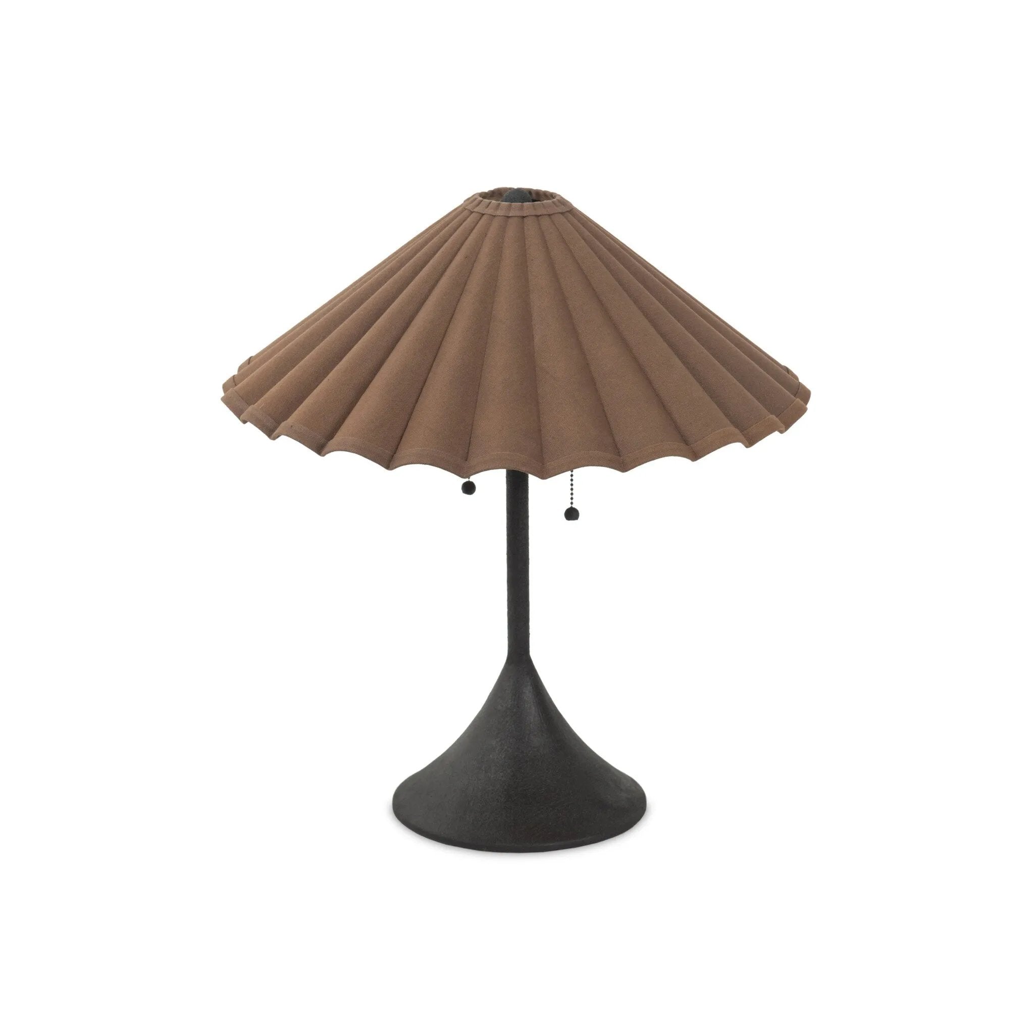 Textures and deep hues unite for this table lamp's beautiful glow. The overscale scalloped shade features a dark canvas exterior covering an antiqued brass interior, and wrought iron pull chains adjust each lightbulb in Baroque-era form Amethyst Home provides interior design, new home construction design consulting, vintage area rugs, and lighting in the Omaha metro area.