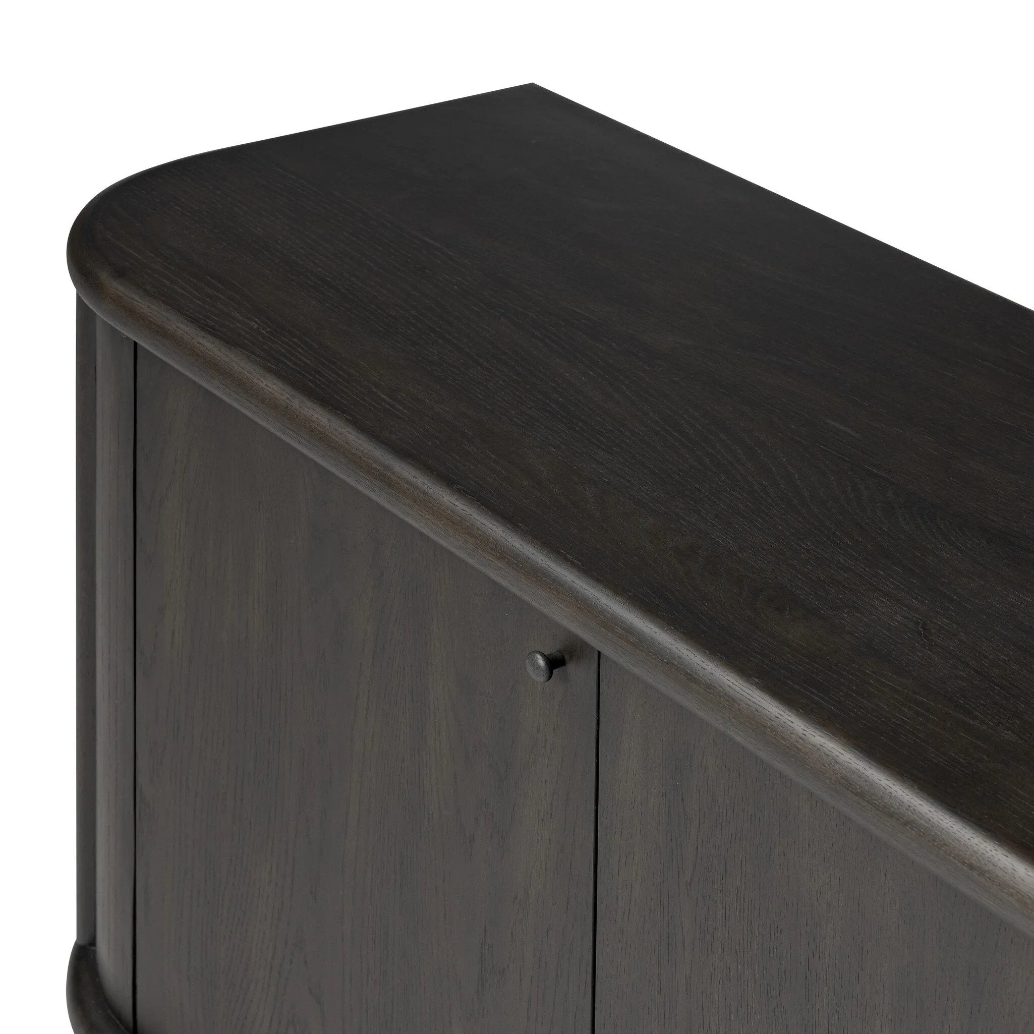 Large cylinder framework defines this oak sideboard with a warm oak finish. Curved lines add softness, while delicate hardwar