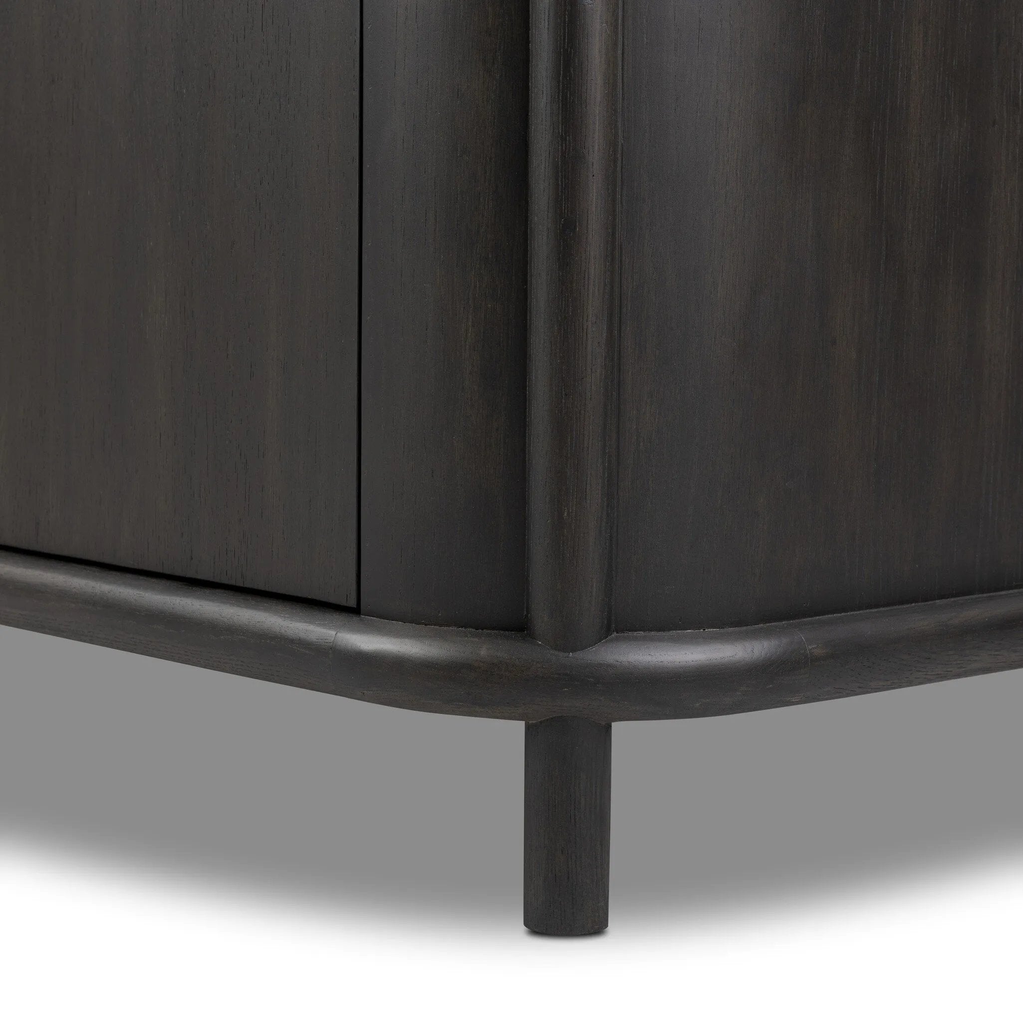 Large cylinder framework defines this oak sideboard with a warm oak finish. Curved lines add softness, while delicate hardwar