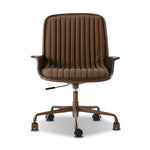 Elevate the office with one easy piece. Inspired by midcentury molded plywood chairs, brown oak veneer frames top-grain leather seat cushioning with slim, soft channeling. A 360-degree swivel burnished brass-finished base with casters allows for easy movement. Amethyst Home provides interior design, new home construction design consulting, vintage area rugs, and lighting in the Washington metro area.
