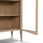 Traditional design defines this light-finished oak cabinet. Simple, clean side panels highlight a softly curved bottom frame. Steel handles in a copper patina finish add a unique touch.As fans of wabi sabi design at Amethyst, we love the nature inspired Gates Cabinet - Light Natural Oak Veneer. Amethyst Home provides interior design, new home construction design consulting, vintage area rugs, and lighting in the Calabasas metro area.