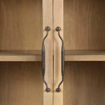 Traditional design defines this light-finished oak cabinet. Simple, clean side panels highlight a softly curved bottom frame. Steel handles in a copper patina finish add a unique touch.As fans of wabi sabi design at Amethyst, we love the nature inspired Gates Cabinet - Light Natural Oak Veneer. Amethyst Home provides interior design, new home construction design consulting, vintage area rugs, and lighting in the Des Moines metro area.