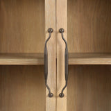 Traditional design defines this light-finished oak cabinet. Simple, clean side panels highlight a softly curved bottom frame. Steel handles in a copper patina finish add a unique touch.As fans of wabi sabi design at Amethyst, we love the nature inspired Gates Cabinet - Light Natural Oak Veneer. Amethyst Home provides interior design, new home construction design consulting, vintage area rugs, and lighting in the Des Moines metro area.